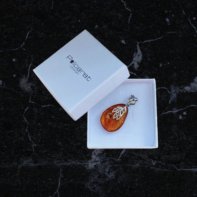 Unique amber pendant with silver charm BW 056