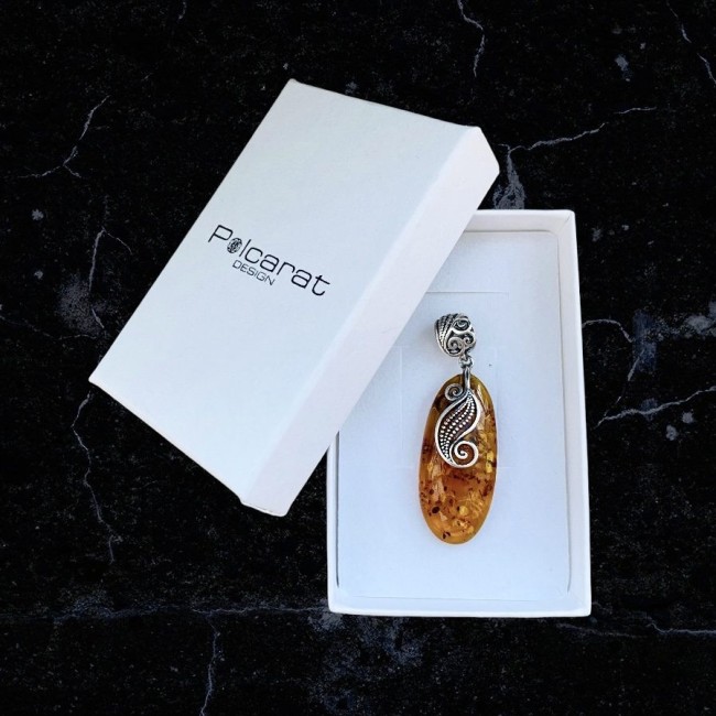 A unique amber pendant wrapped in silver pattern BW 110