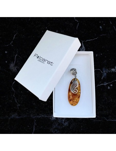 A unique amber pendant wrapped in silver pattern BW 110