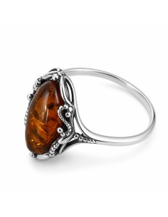 Classic design of a ring with coral. Large selection of jewelry with natural stones only at Polcarat Design!