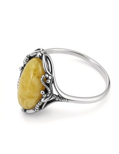 Classic design of a ring with coral. Large selection of jewelry with natural stones only at Polcarat Design!