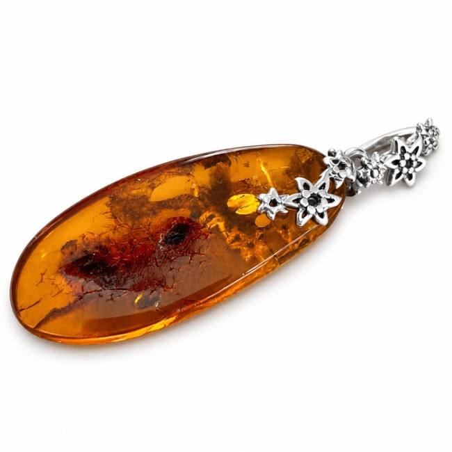 Unique amber pendant wrapped in silver flowers BW 112