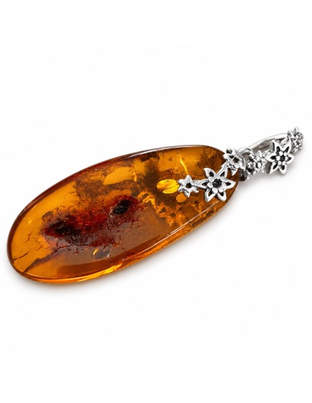 Unique amber pendant wrapped in silver flowers BW 112