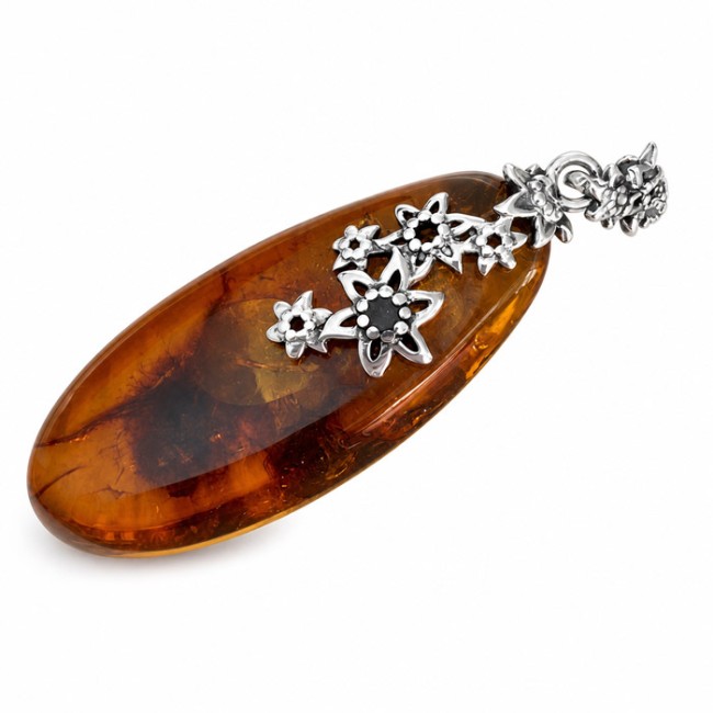 Unique amber pendant wrapped in silver flowers BW 112